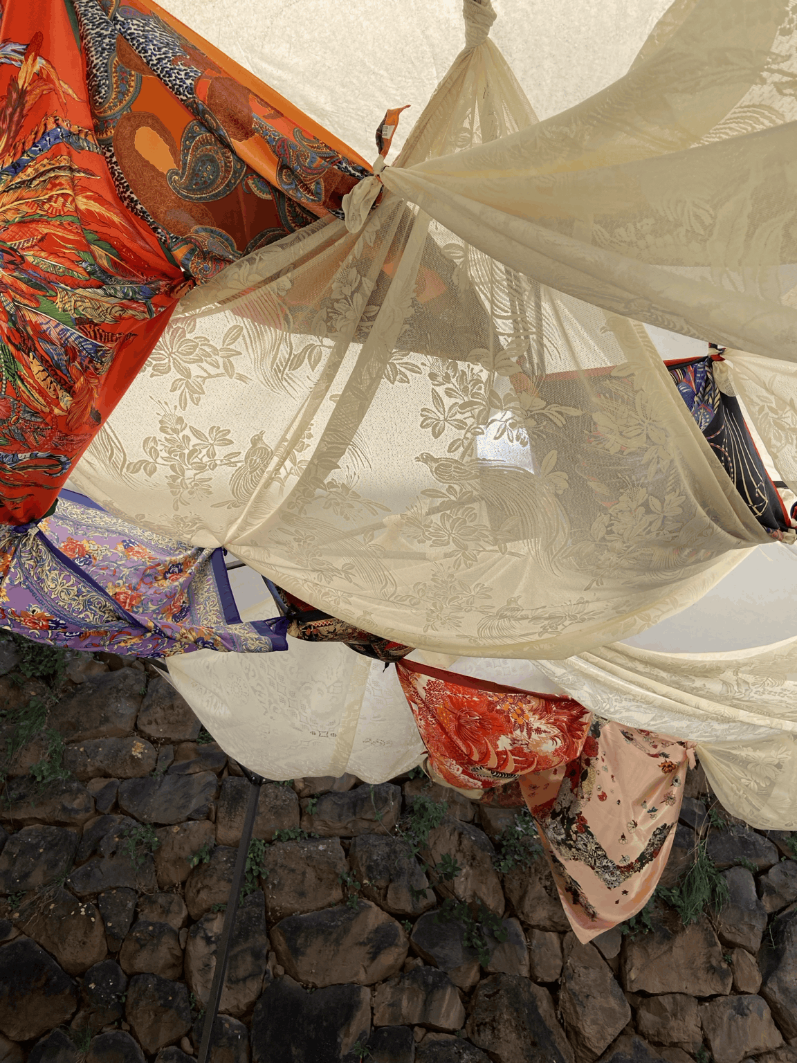 Textiles and light in the garden at domperú