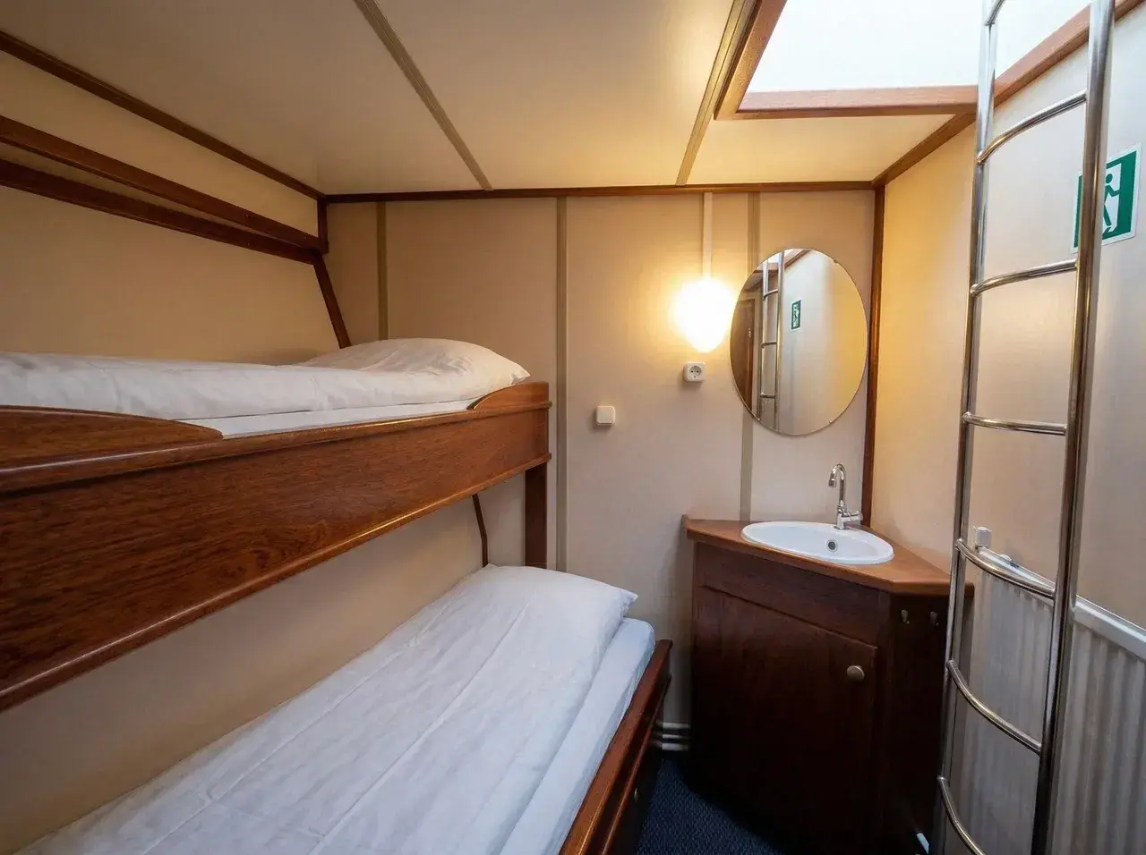 Comfortable twin cabin with private bathroom aboard an Antarctic expedition sailing yacht.
