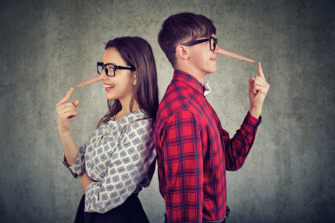 Smiling man and woman wearing glasses and fake long noses, standing back to back, symbolizing mutual deception or hidden truths in a relationship