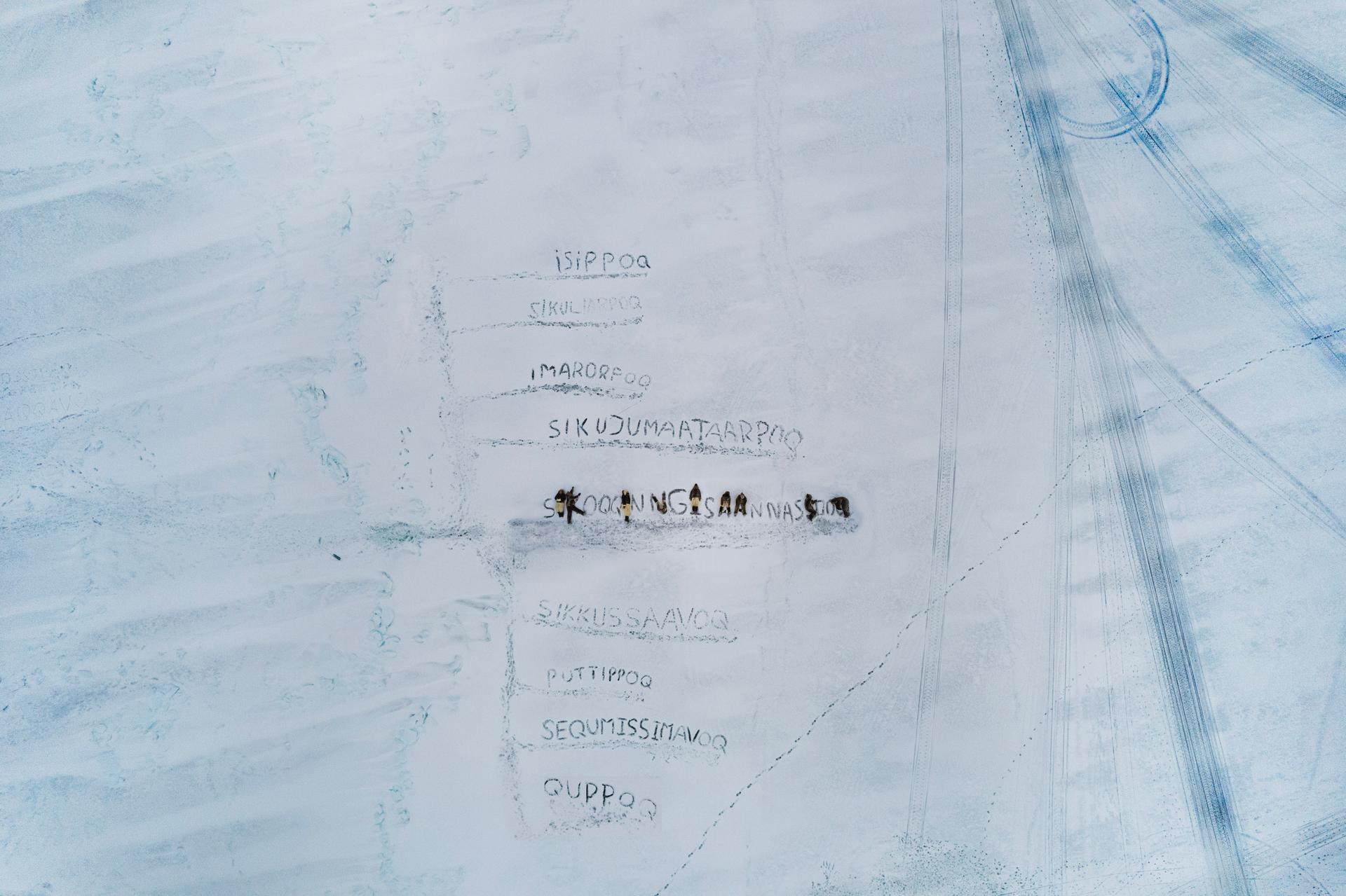 Greenland | Adam Sébire. Children in Uummannaq carve words into melting sea ice, using their language to describe the climate changes they are witnessing.