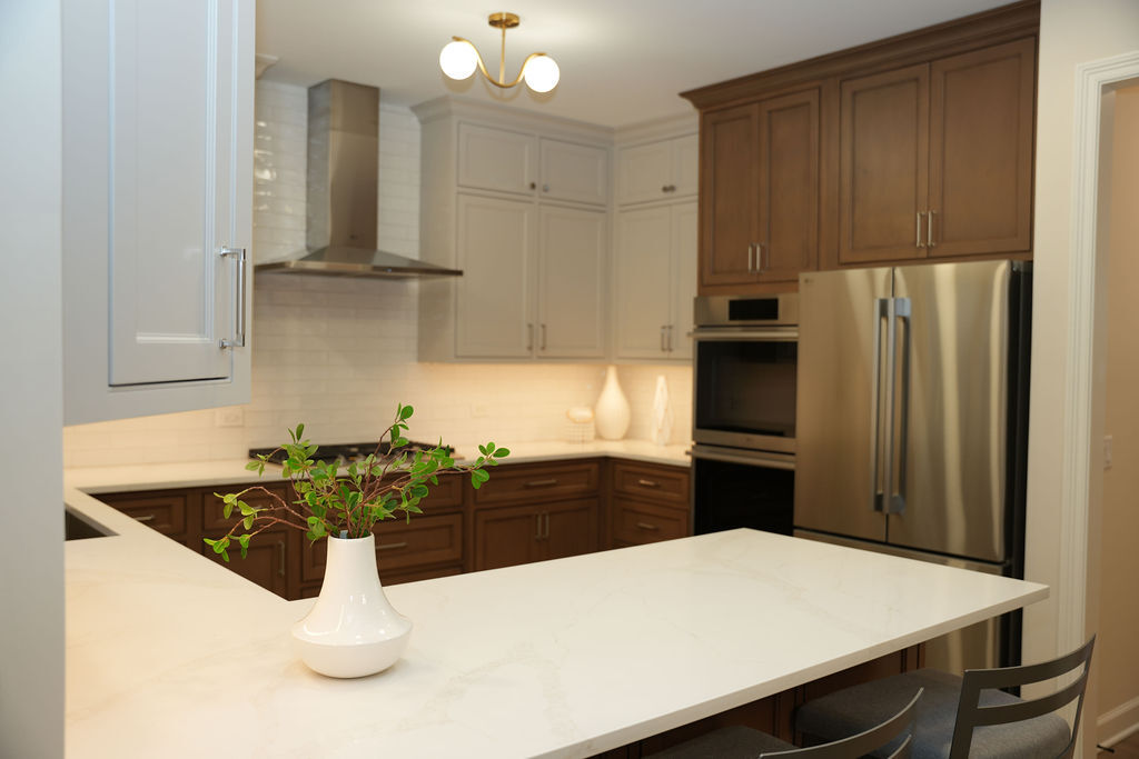 Open concept kitchen remodel with island and connected living space by CASA Kitchen &amp; Bath in Naperville, Illinois