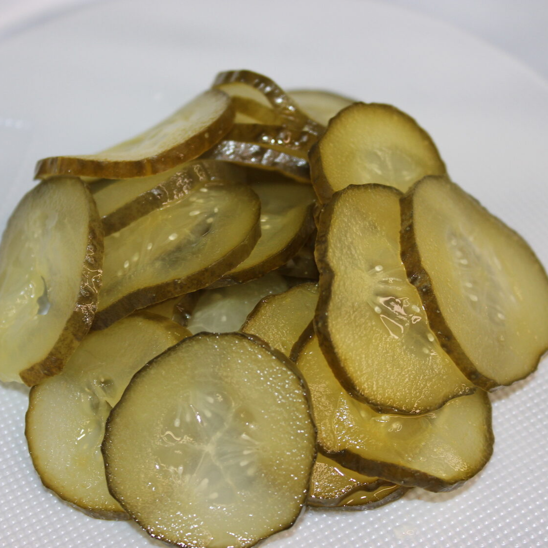 Огурцы маринованные резанные слайсами Посольские