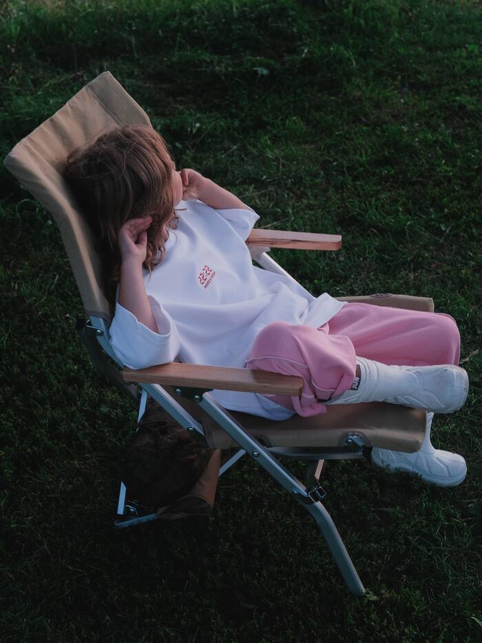 Girl resting on chair