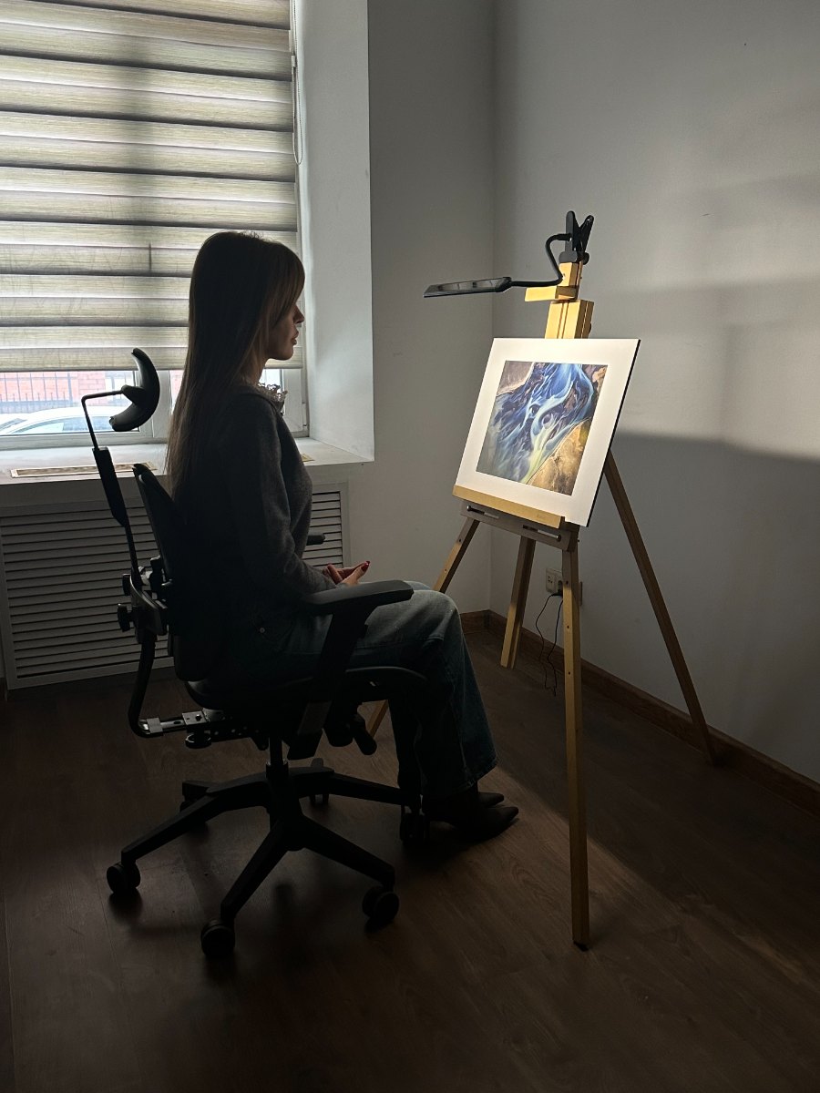 A participant in front of a photo portal on an easel during the study