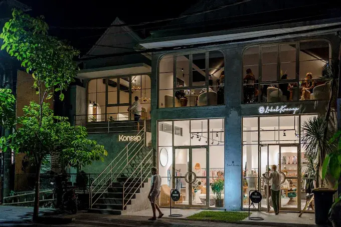 The glowing, modern multi-level exterior of Manhattan Kitchen & Cocktail Bar, bringing sophisticated city and speakeasy vibes to the best bars in Bali.