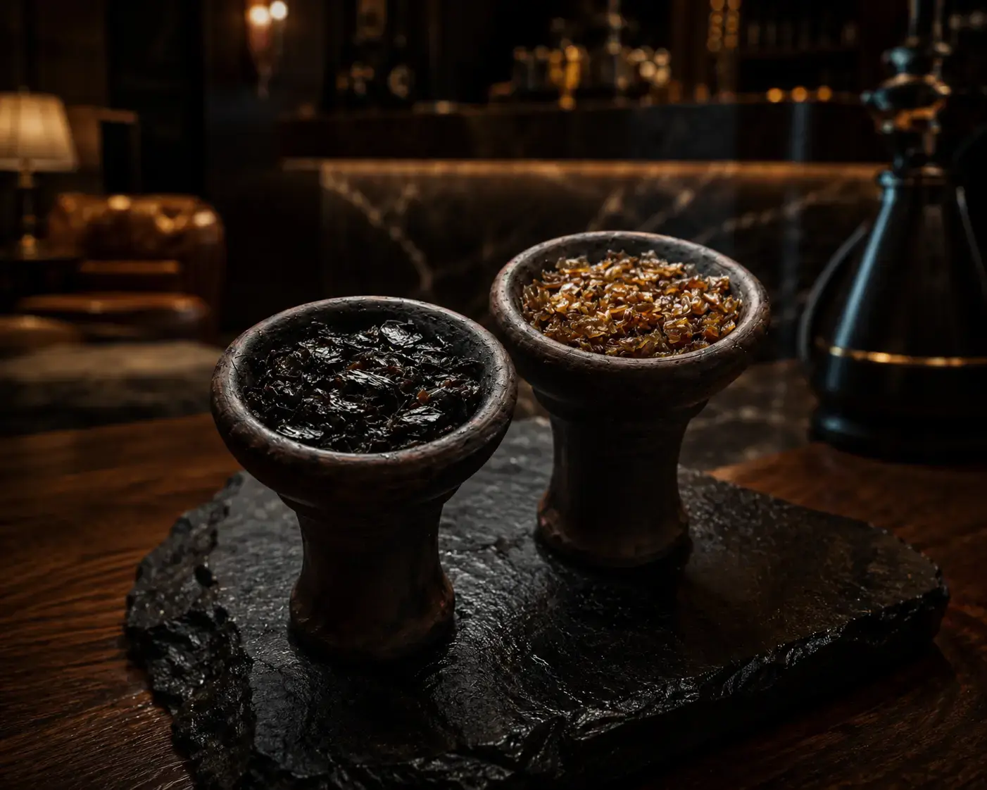 Two handcrafted shisha bowls filled with dark leaf and blonde leaf tobacco, showing how different tobacco bases influence flavor, strength, and cooling sensation.