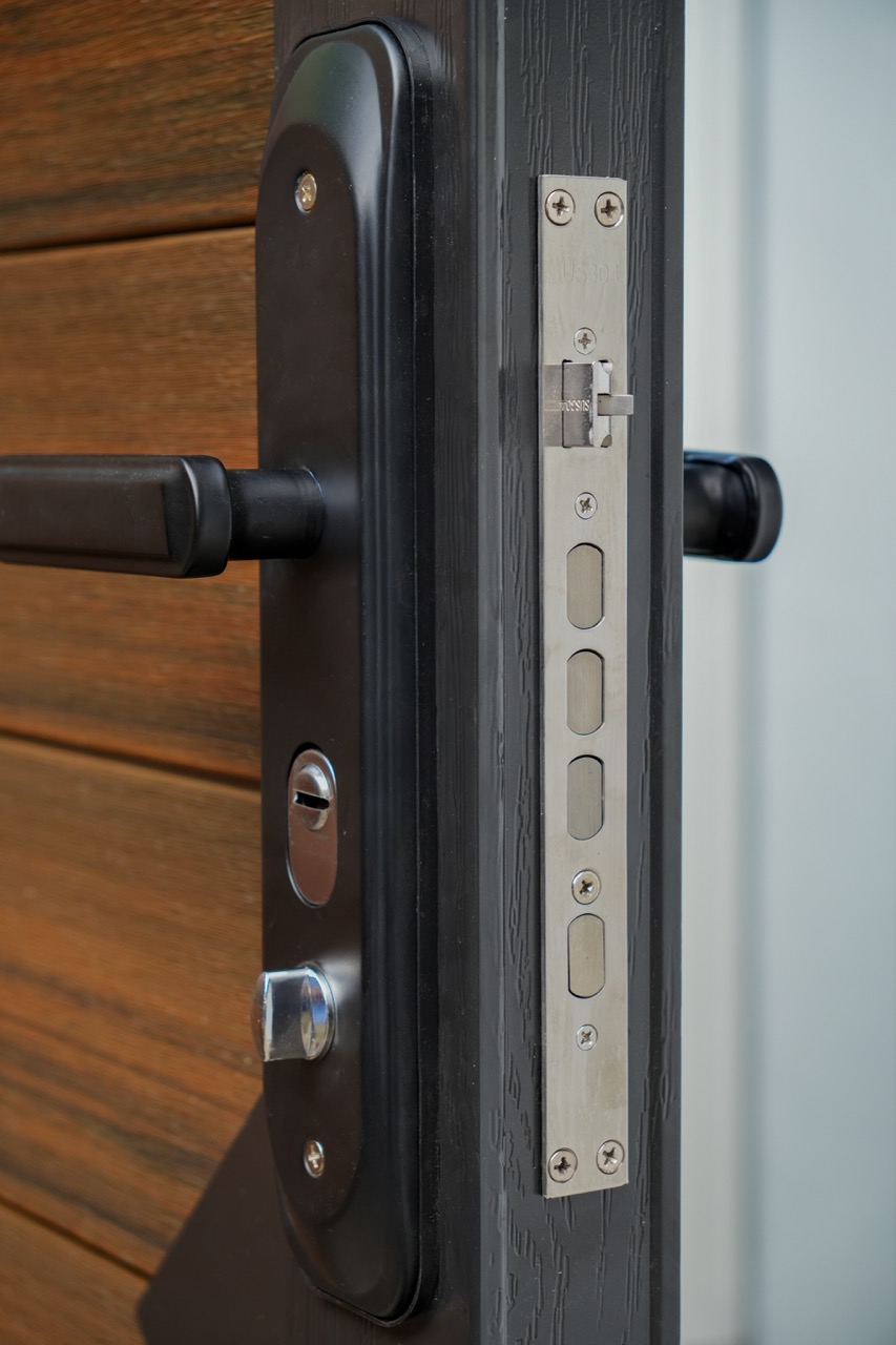 Close-up of WPC gate lock and hardware detail