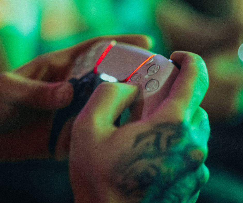 a man playing PS5 in a Bar