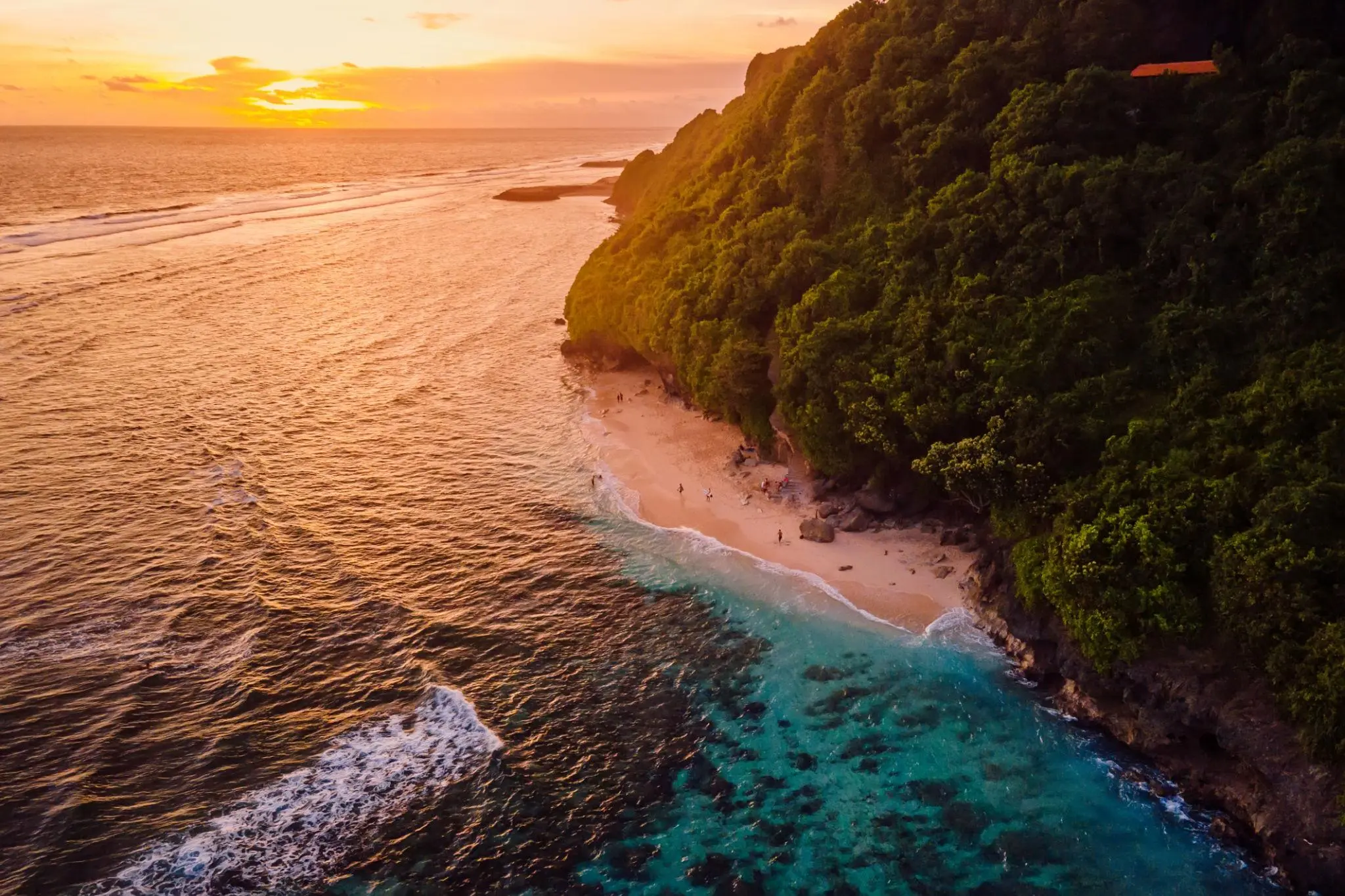 Bali Itinerary guide cover showing a tropical coastline and beach at sunset