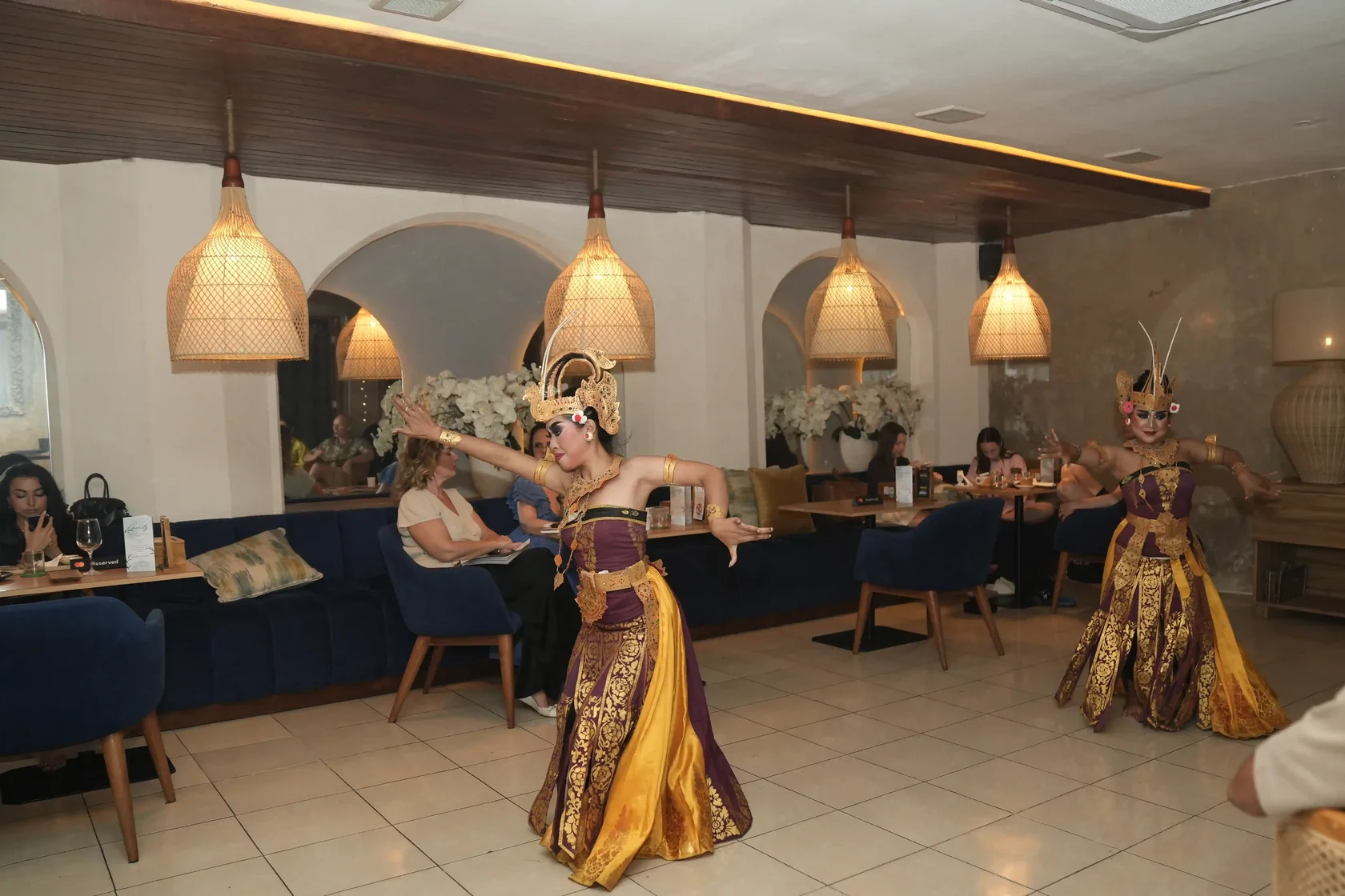 Balinese dancers performing at Eden Lounge Ubud, a sanctuary for travelers exploring nearby Bali sacred locations.