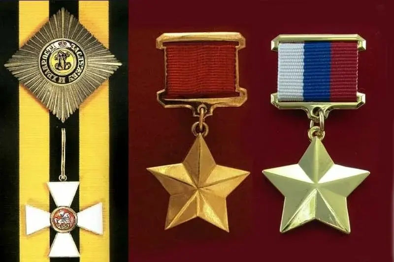 Фотография Ордена Святого Георгия и медали Золотая Звезда Героя Российской Федерации, лежащих рядом на бархате.