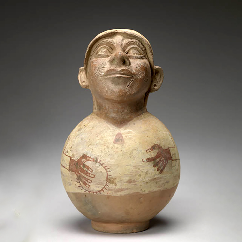 Сосуд в виде человека с раковиной спондилюса. Моче, 500-700 гг. н.э. Коллекция Mount Holyoke College Art Museum.