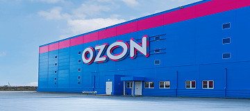 Blue ozone building with pink insert and white logo on top