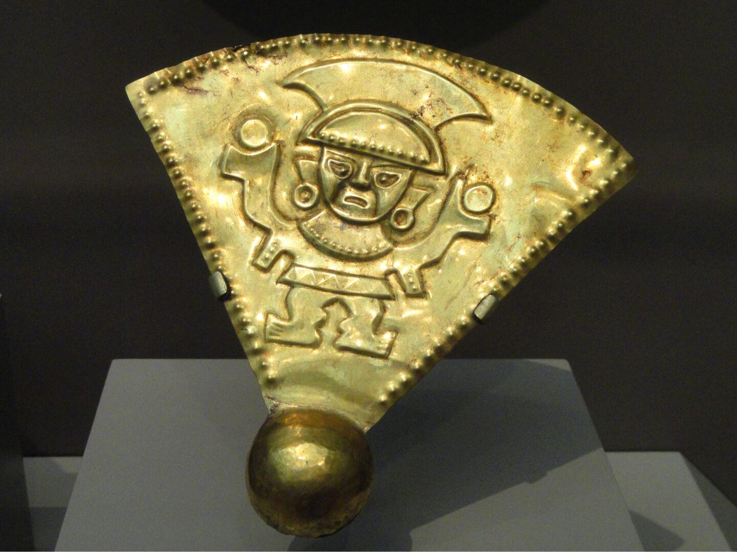 A golden chimu rattle, 1100-1470 CE