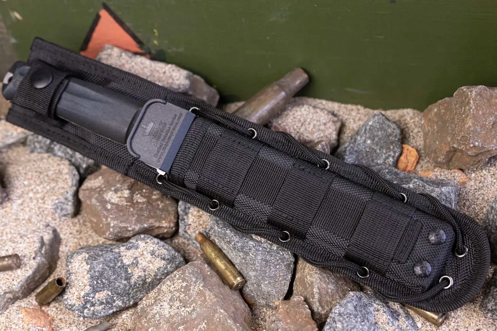 Aggressor ballistic nylon sheath showing its adaptable attachment system