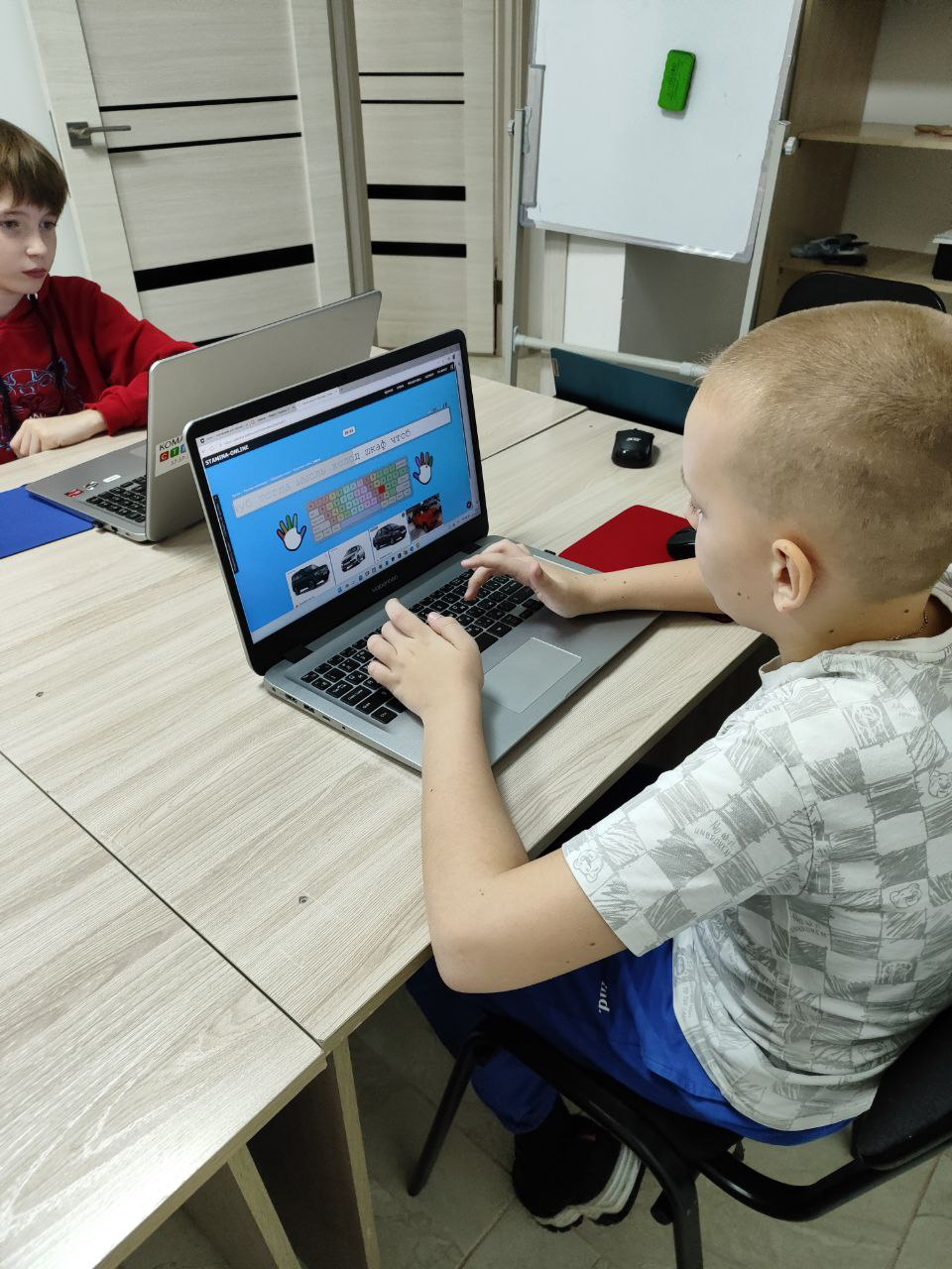 Kid learning on laptop