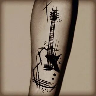 Музыкальные символы в татуировках гитары