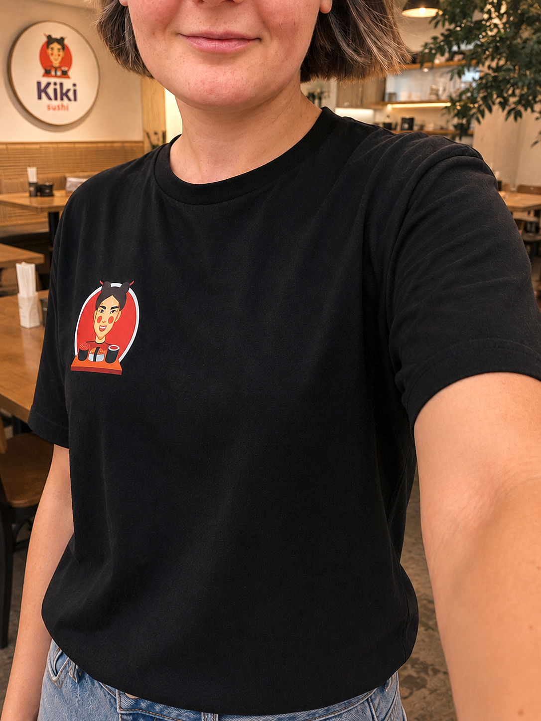 Kiki Sushi founder wearing a branded T-shirt
