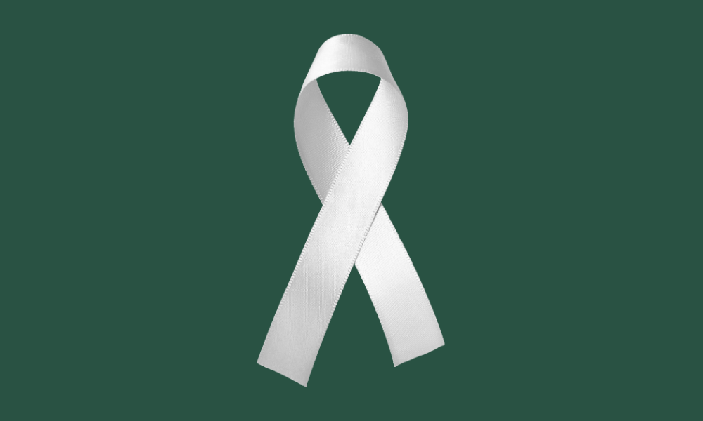 White Ribbon on a dark green background