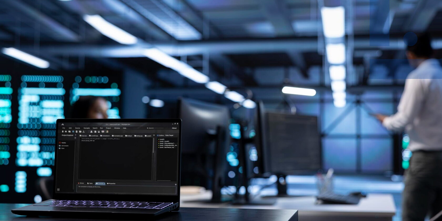 IT company office with a laptop and code on screen symbolizing software development, IT services and residency in Moldova IT Park.