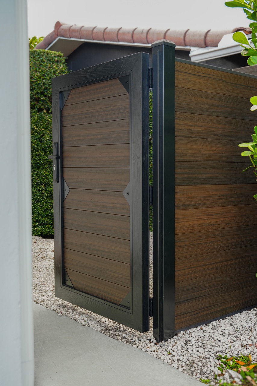 WPC privacy fence and gate in a residential setting