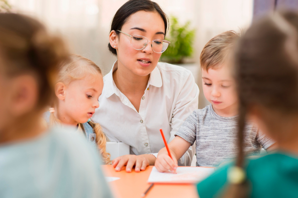 A teacher is doing assignments with primary school students.