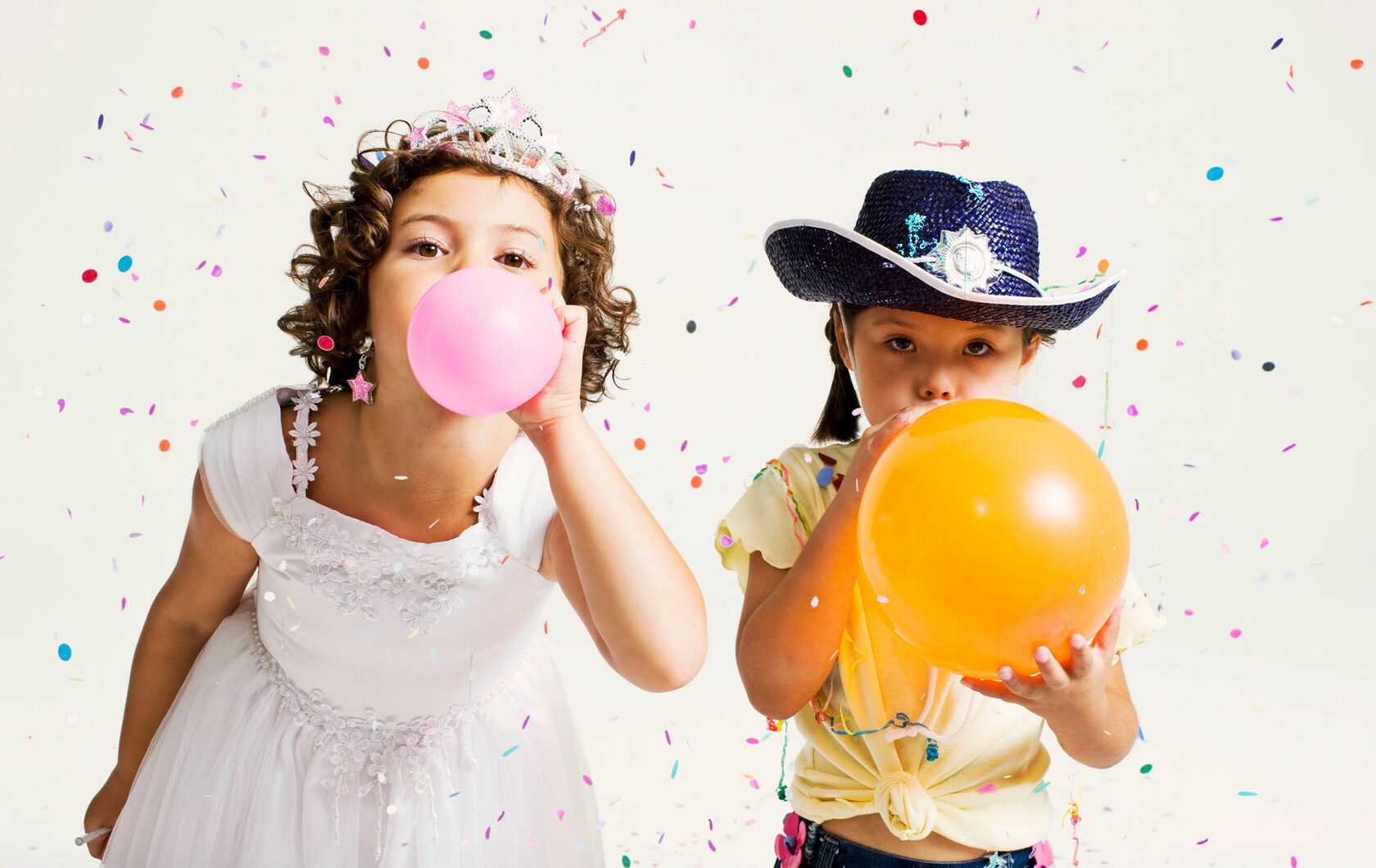 Girl Blowing Balloons