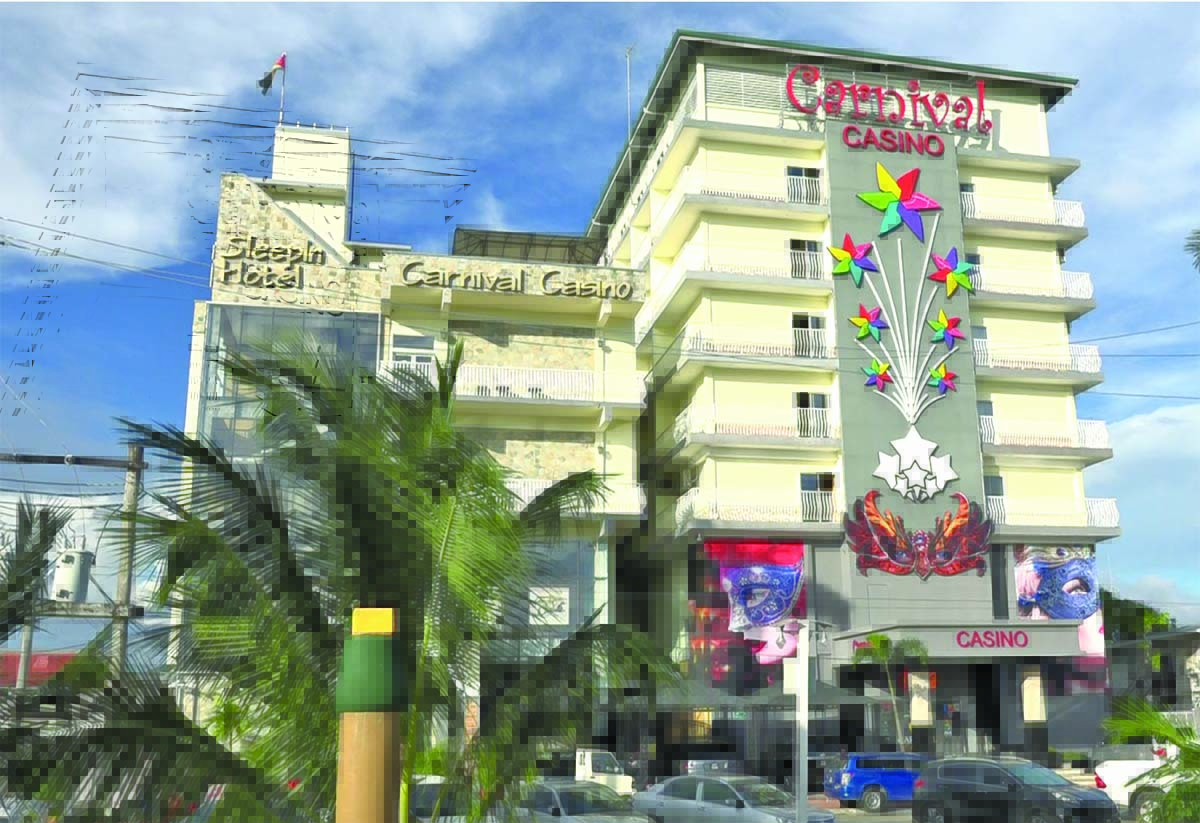 A low-angle exterior shot of a hotel and casino complex. The building has a sign for &amp;amp;amp;amp;amp;amp;amp;quot;Sleepin Hotel&amp;amp;amp;amp;amp;amp;amp;quot; on the left and &amp;amp;amp;amp;amp;amp;amp;quot;Carnival Casino&amp;amp;amp;amp;amp;am