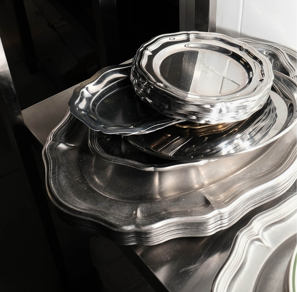 polished metal tableware composition for RENÉE CAFÉ branding