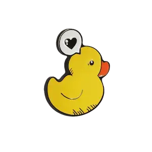 металлический значок в виде утки