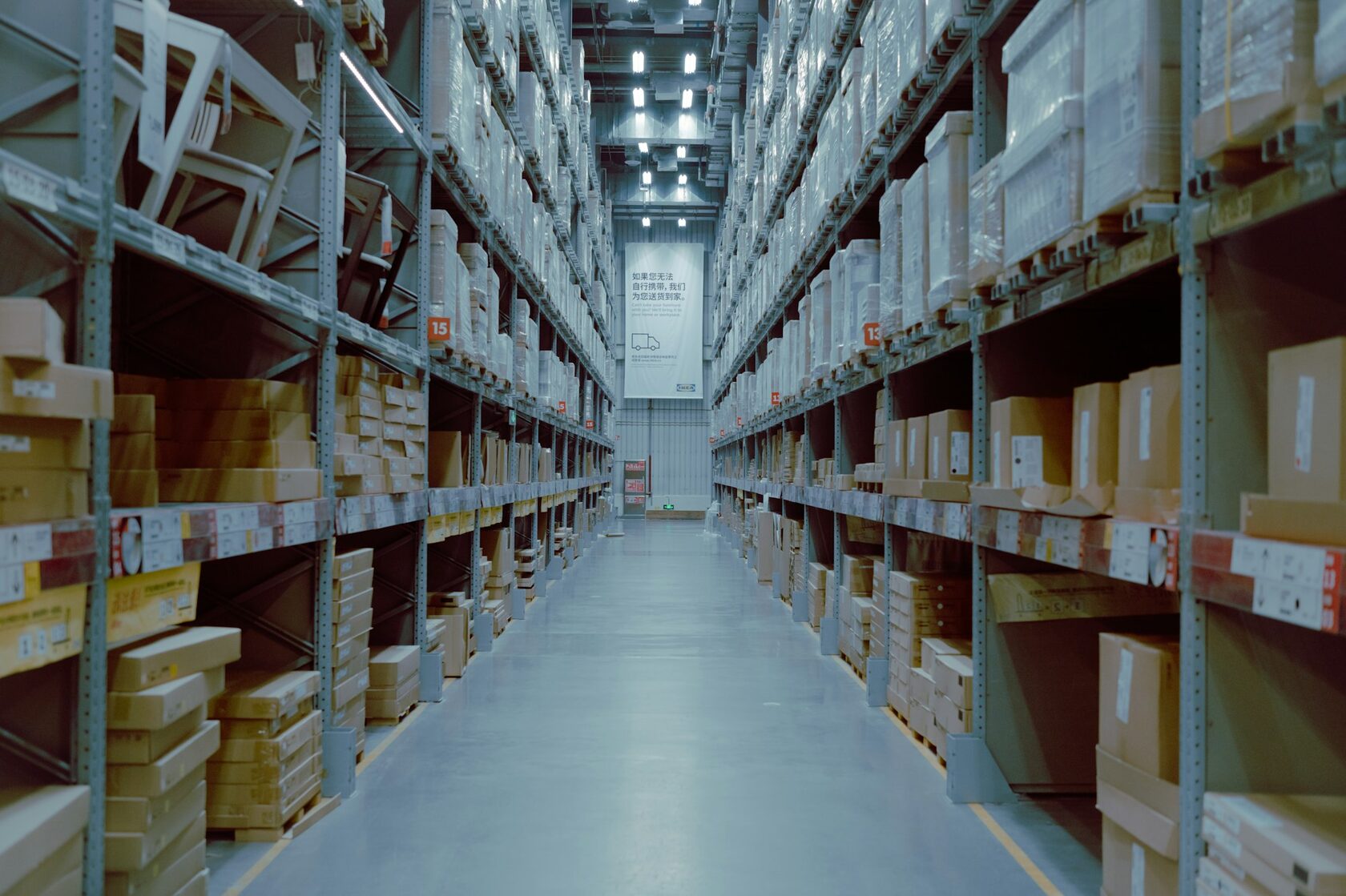 Modern logistics warehouse with rows of shelves
