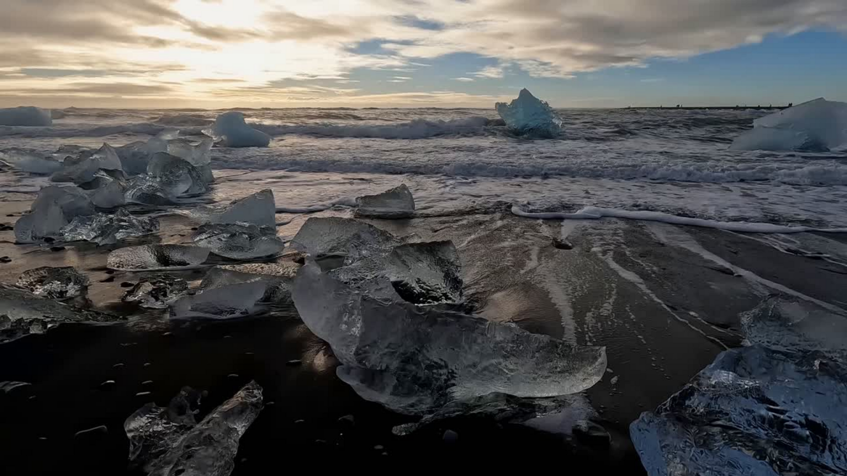 diamonds in the rough surf of diamond beach in iceland
