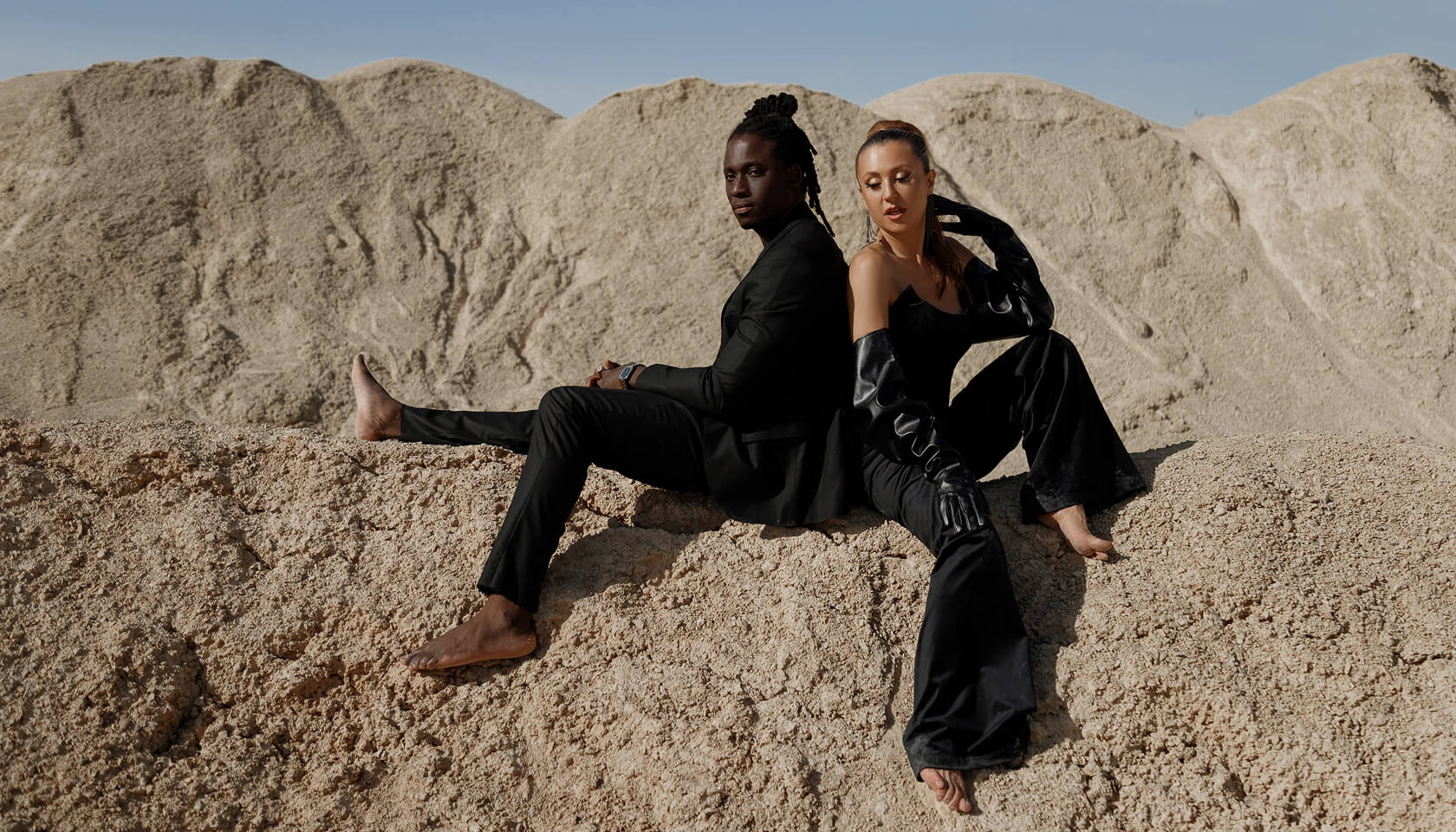 Orisha Sound, Cinematic depiction of a couple in the desert representing movement, performance, and luxury lifestyle for an editorial media brand