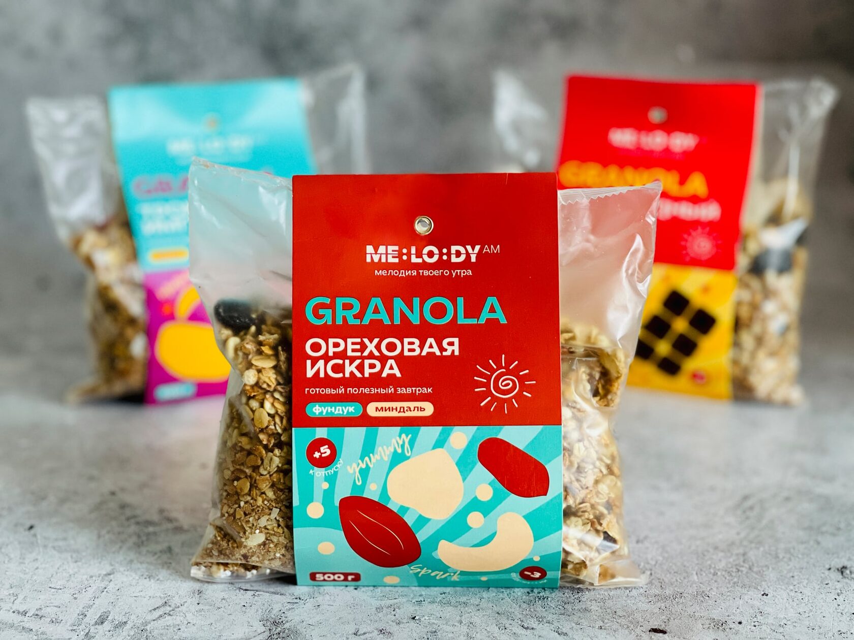 Tres variedades de granola ME:LO:DY en sus envases originales