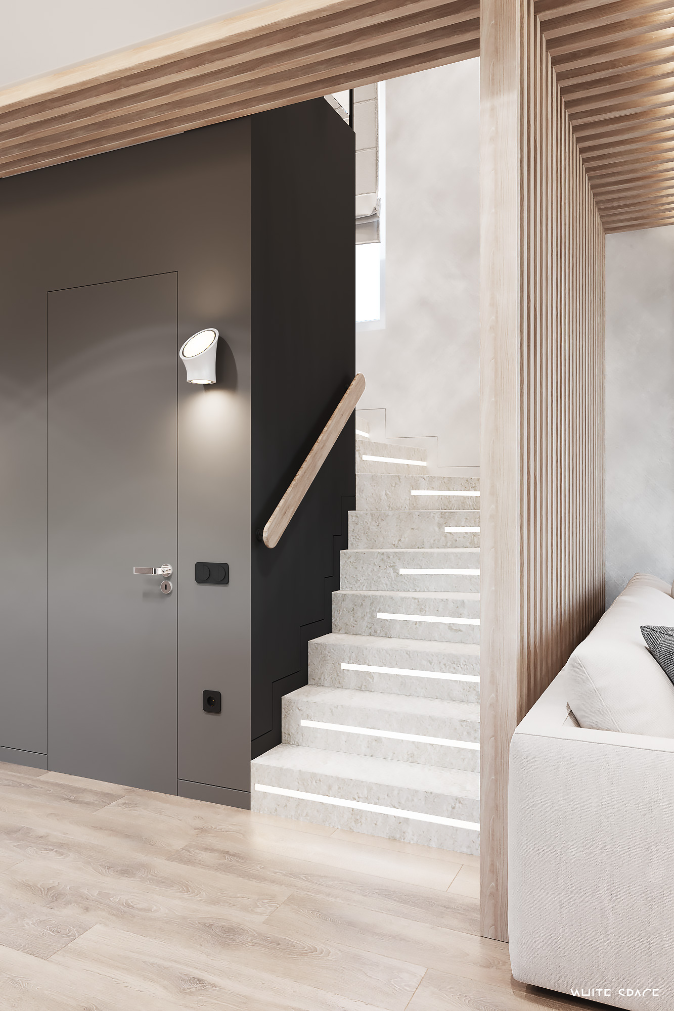 Escalier minimaliste menant à l’étage dans une maison à l’esthétique contemporaine