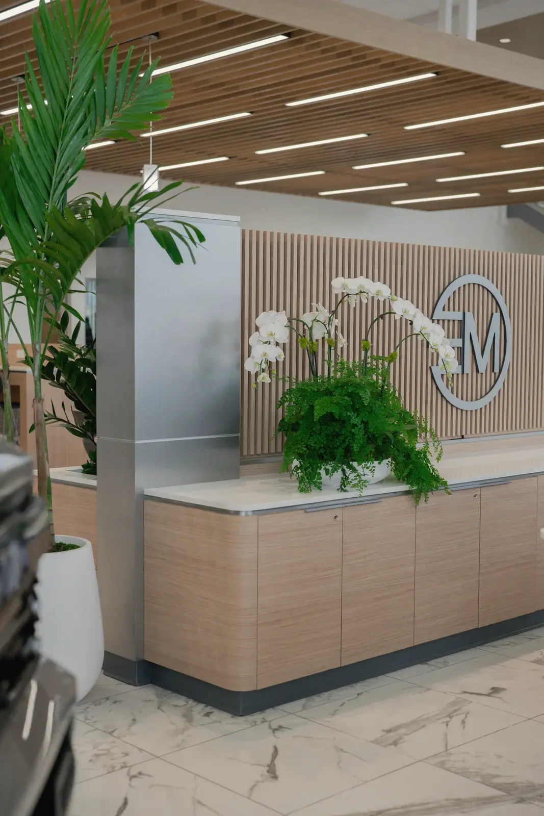 Palm and orchids at the reception desk, Toyota of West Covina
