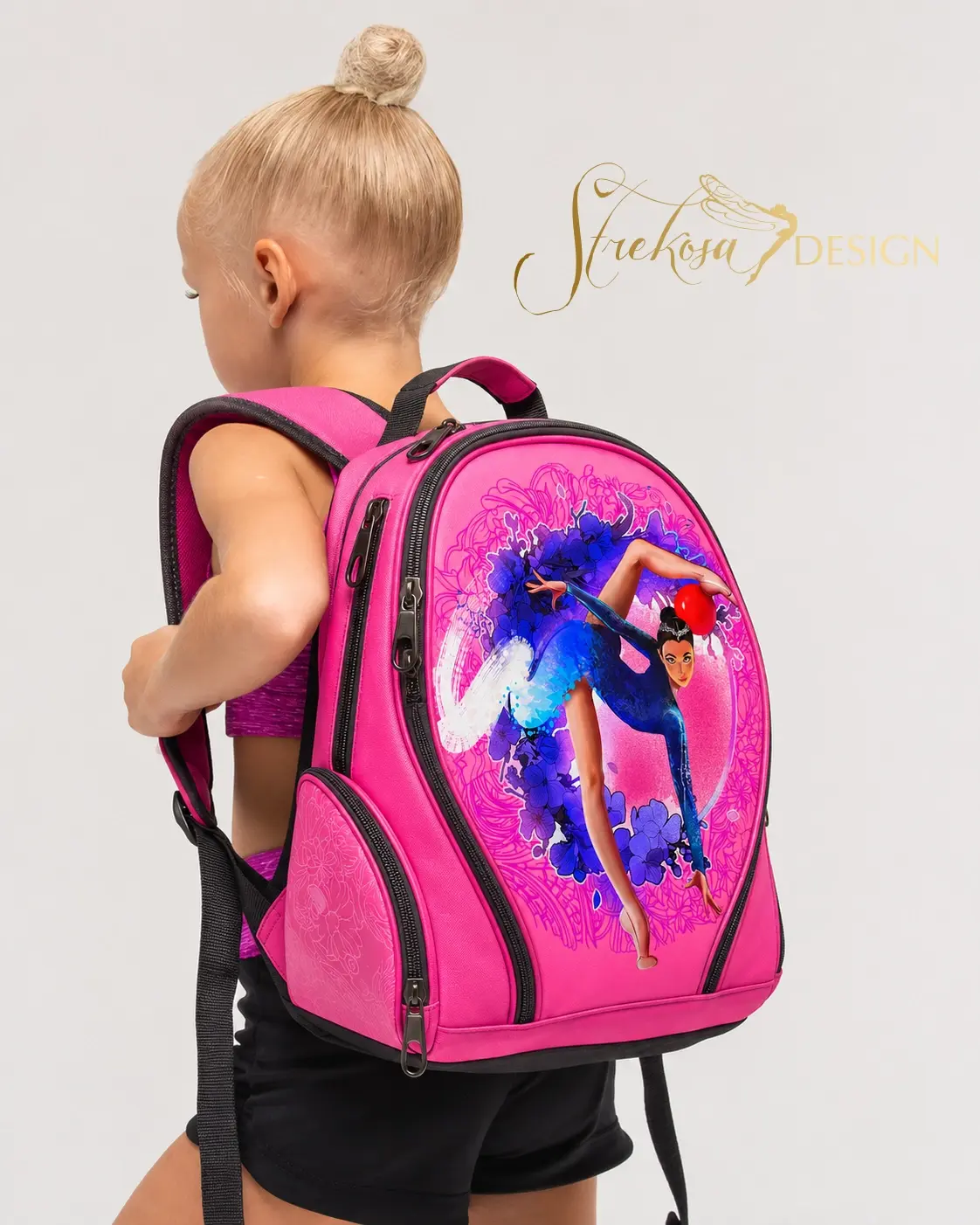 Young gymnast carrying a pink illustrated backpack