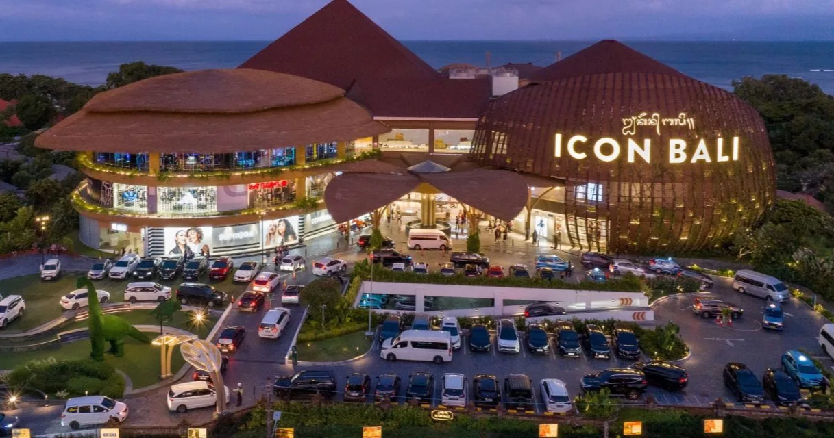 The beautifully lit exterior of iCon Bali Mall at dusk, home to the island's only IMAX theater and a great destination for where to watch a movie in Bali.