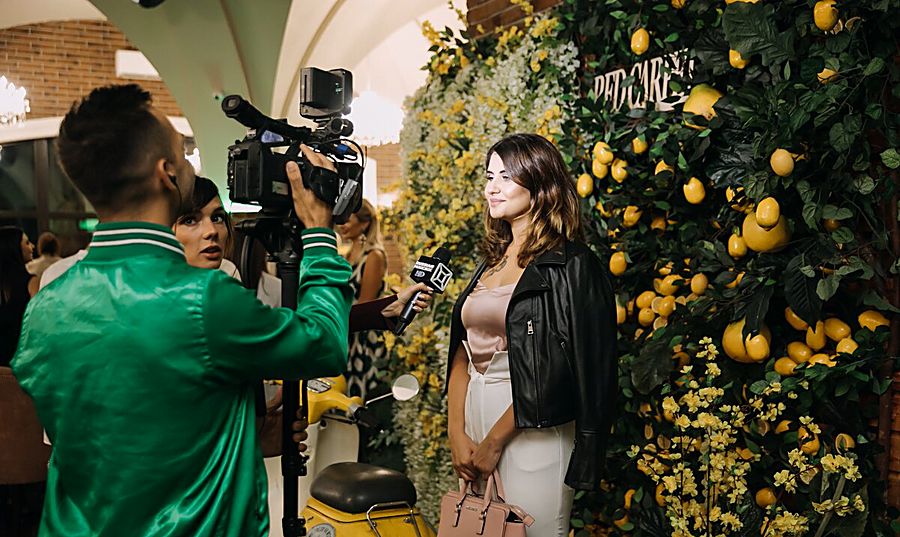 On-camera interview at a red carpet event