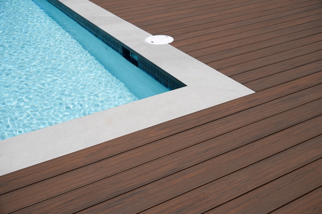 Composite decking installed around a pool area