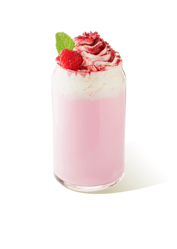 Raspberry milkshake in a glass with whipped cream, fresh raspberry and mint, made using The Base Beverage powder mix