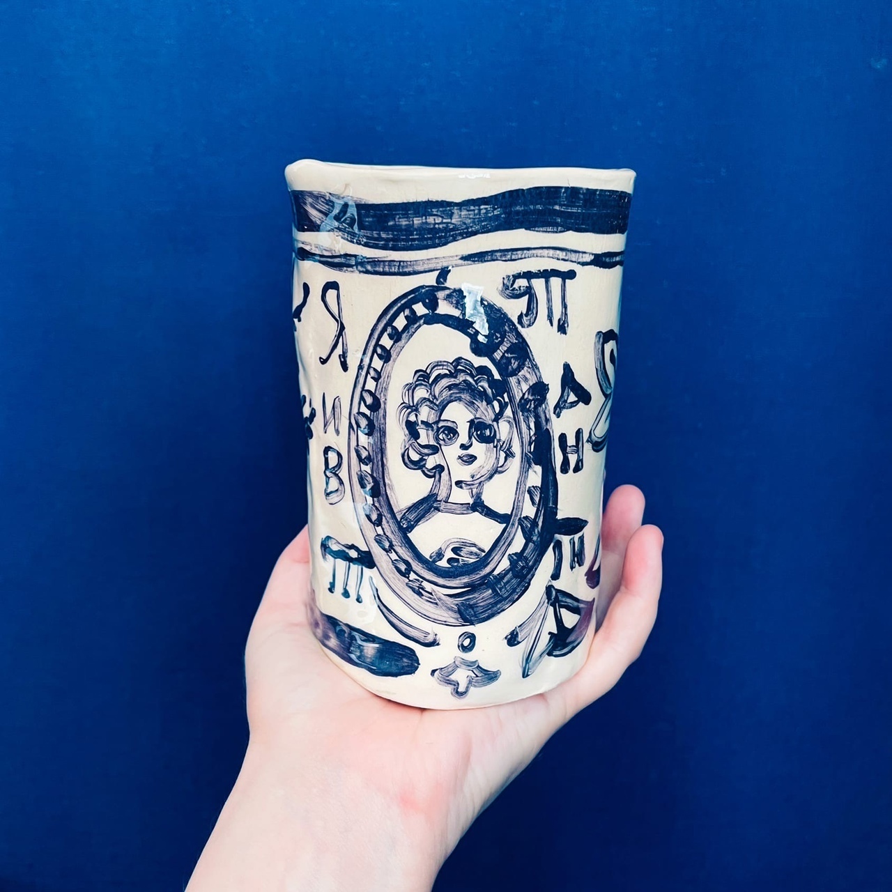 pottery wheel classes Toronto handmade mug with blue glaze