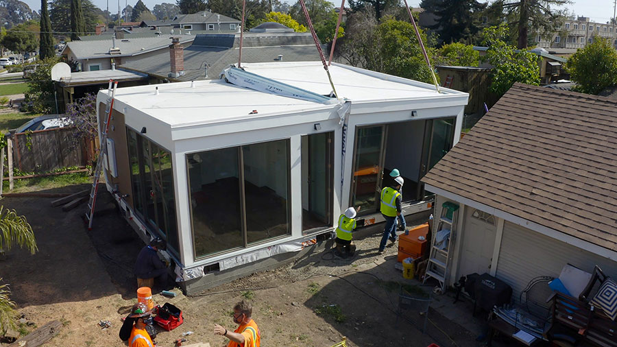 Workers help install a Mighty Buildings accessory dwelling unit in San Leandro. MIGHTY BUILDINGS
