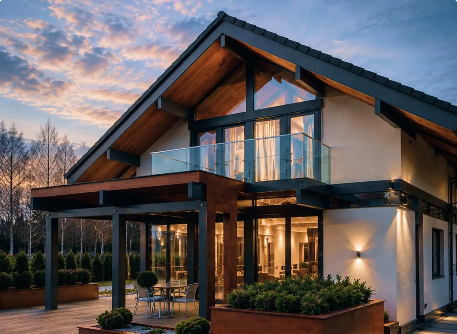 Фахверковый дом INTEQ.HAUS с панорамным остеклением в вечернем свете
