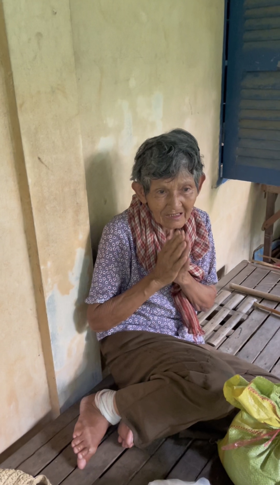 Detail of elderly hands at work in rural Cambodia