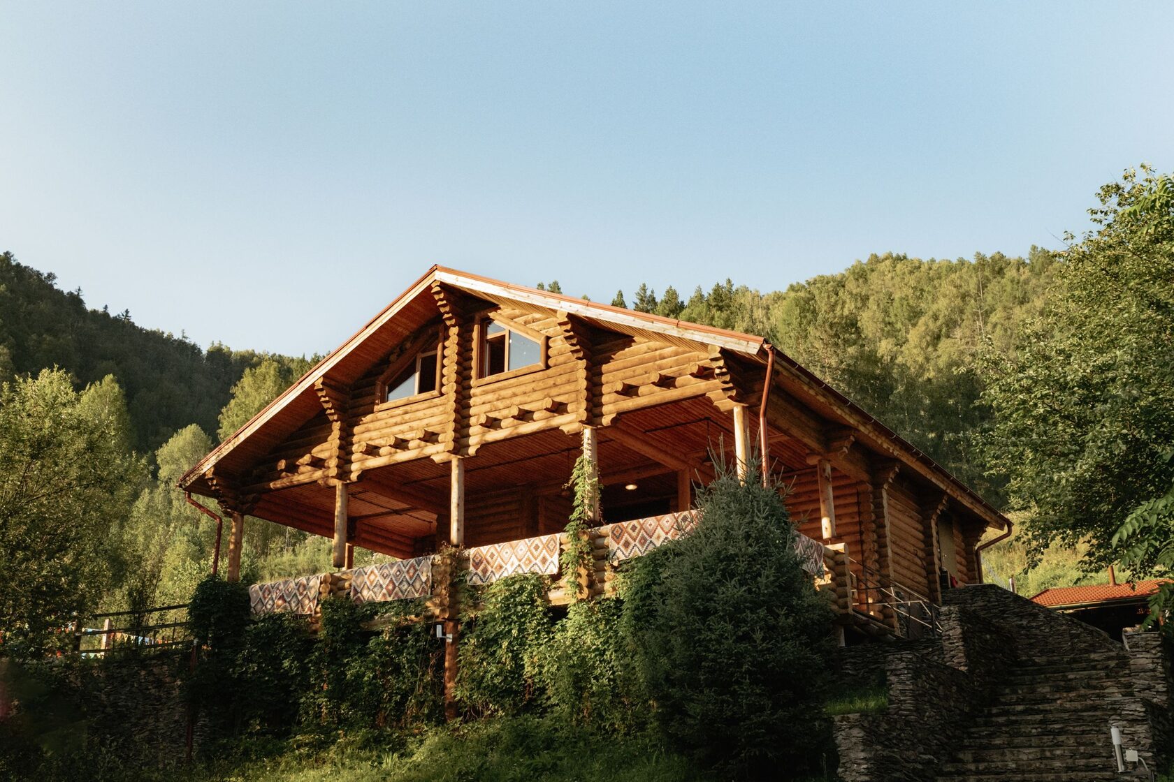 Two-storey log cabin in forest