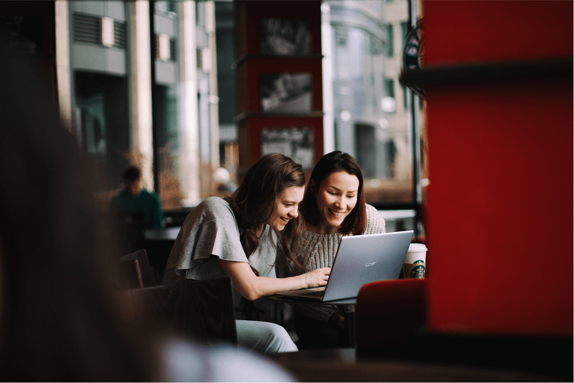 Girls with laptop - roots tourism services