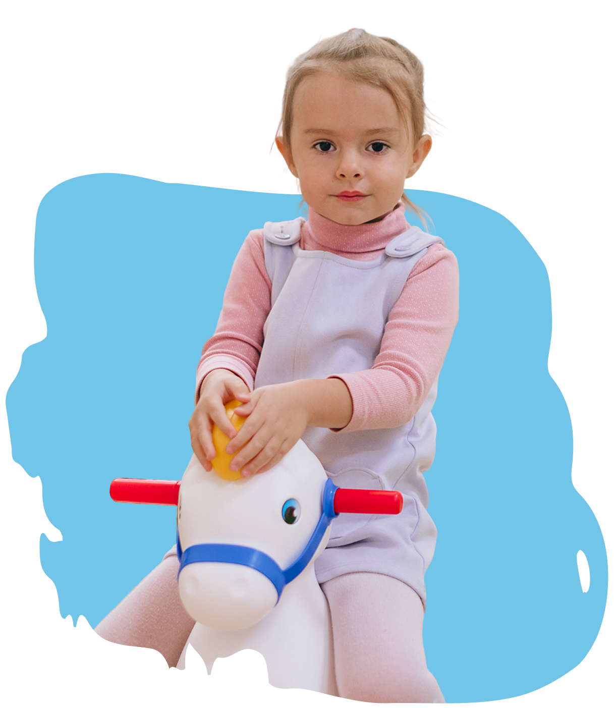 Девочка с аутизмом на игрушечном коне