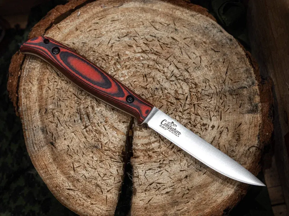 Companero black and red G10 knife with its fitted leather sheath
