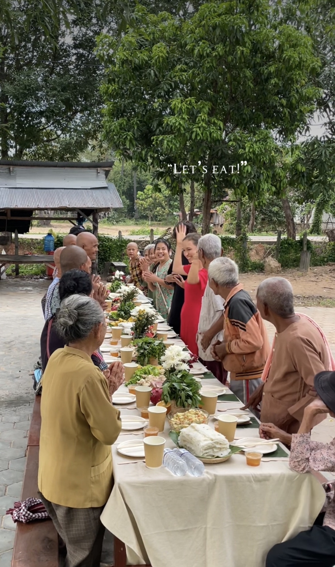 Village elders gathered for a shared dinner outdoors